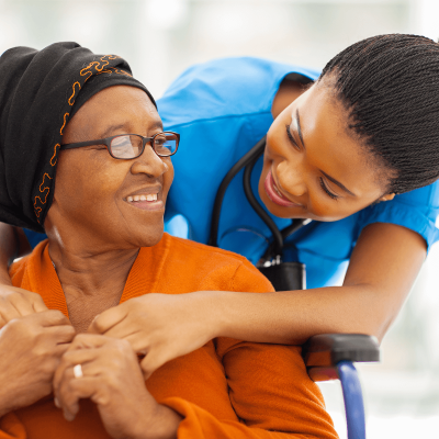 caregiver-talking-with-elder-woman-wheelchair