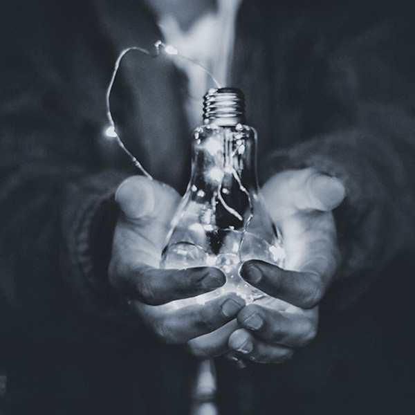 lightbulb in hands